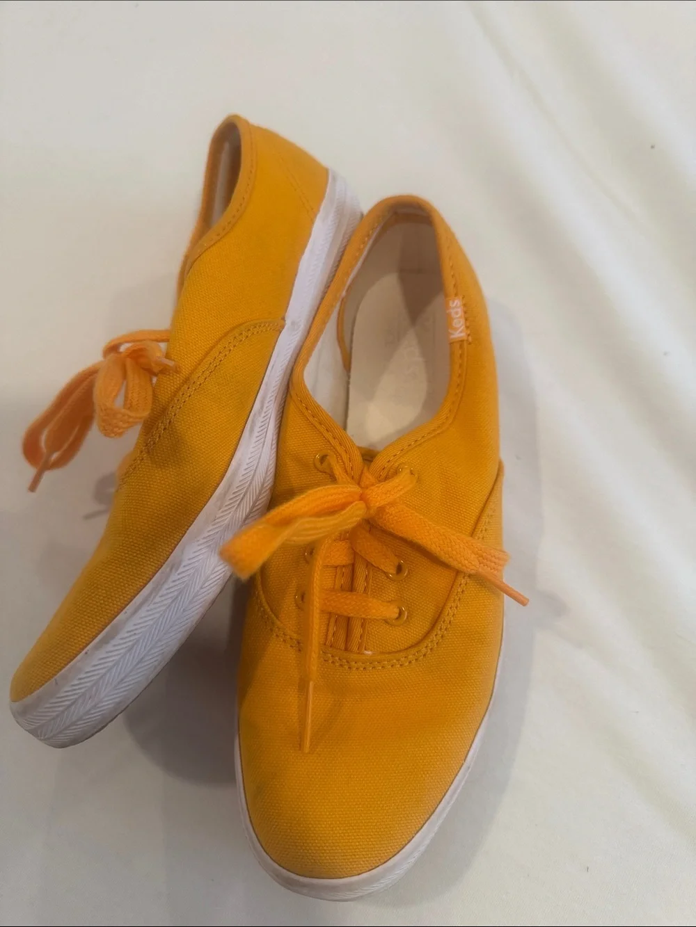 Keds women’s Canvas Lace-Up Sneakers in Yellow